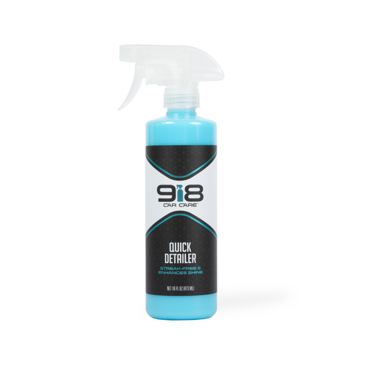 16fl oz white spray bottle with black trim of 918 Quick Detailer: Streak-Free & Enhances Shine. Both the subheading, and the spray bottle in the company logo, are light blue.